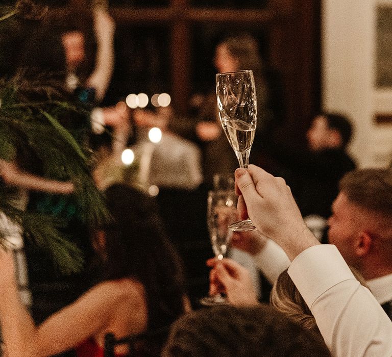 wedding-guest-raises-a-glass-in-toast