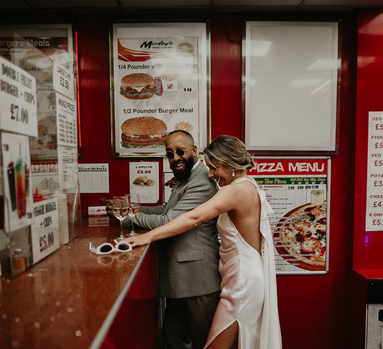 bride-and-groom-ordering-fried-chicken-at-chicken-shop