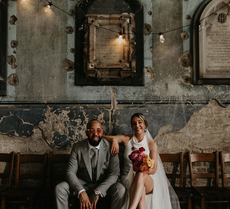 bride-and-groom-posing-for-their-couple-portrait-at-city-wedding