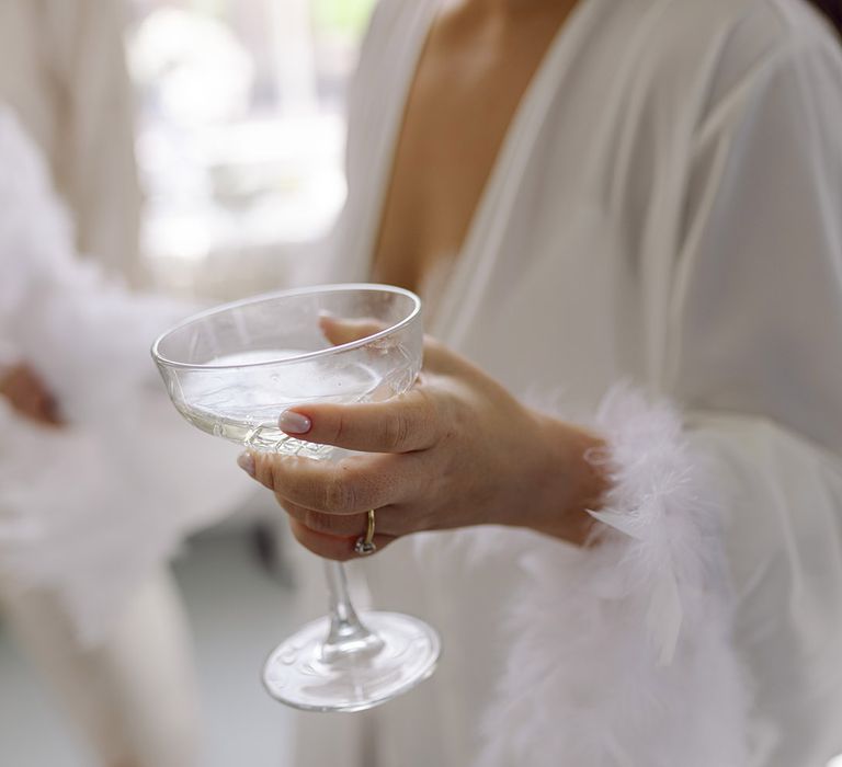 bride-drinking-cocktail-on-morning-of-the-wedding