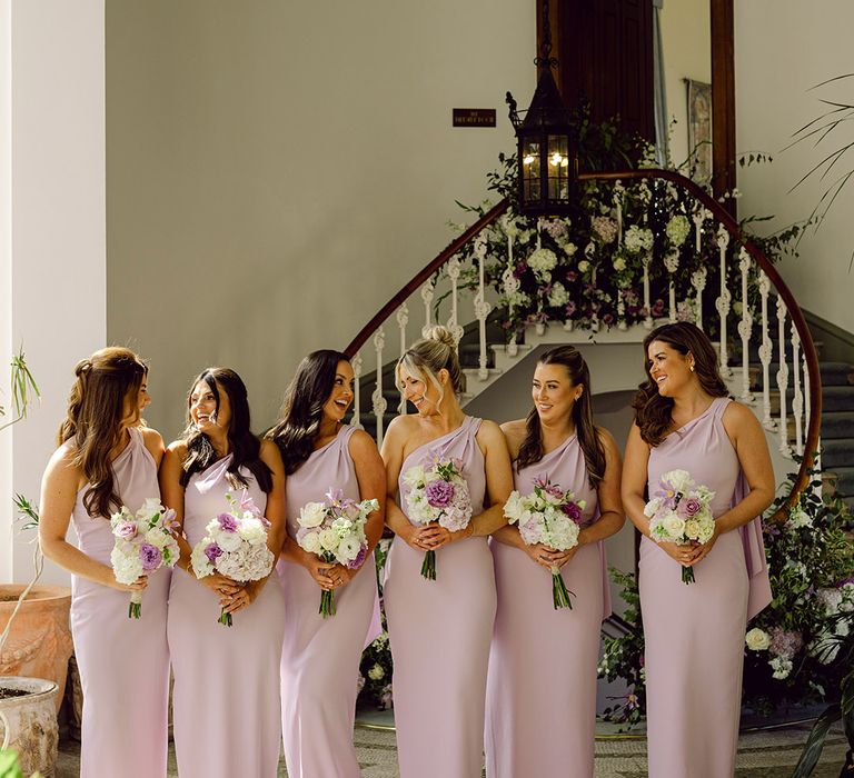 one-shoulder-lilac-bridesmaid-dresses-with-white-and-purple-bouquets