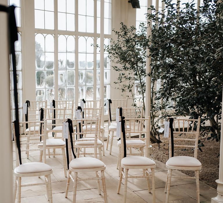 black-ribbons-decorating-wedding-chairs