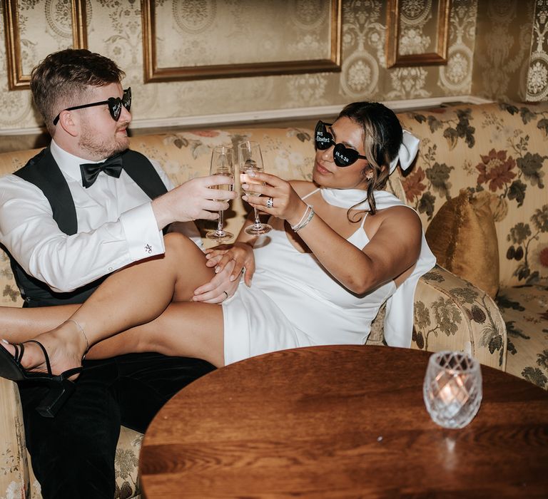 bride-and-groom-at-wedding-reception-with-black-sunglasses