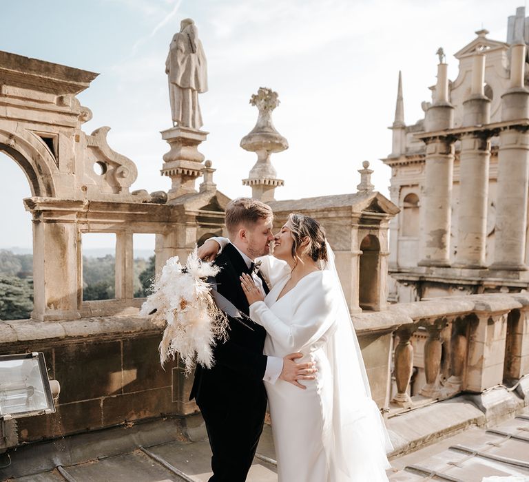 bride-and-groom-share-a-kiss-at-wedding