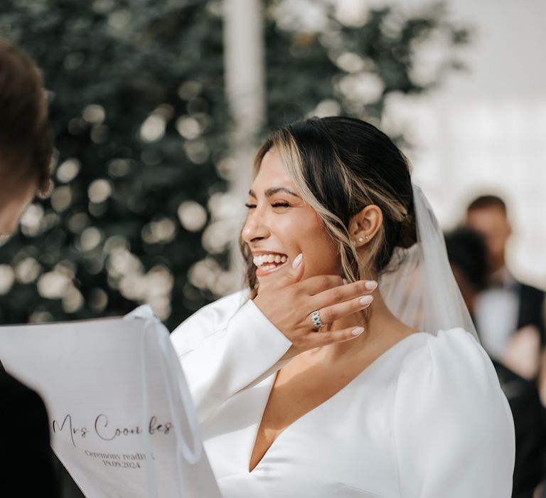 bride-reads-out-wedding-vows-during-wedding-ceremony