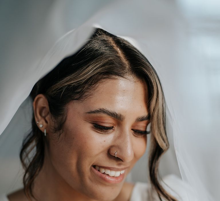 bride-with-natural-bridal-makeup-and-nose-piercing