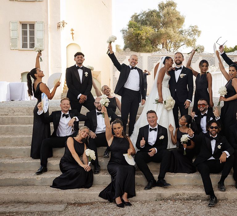 black-tie-wedding-with-black-bridesmaid-dresses-and-tuxedos