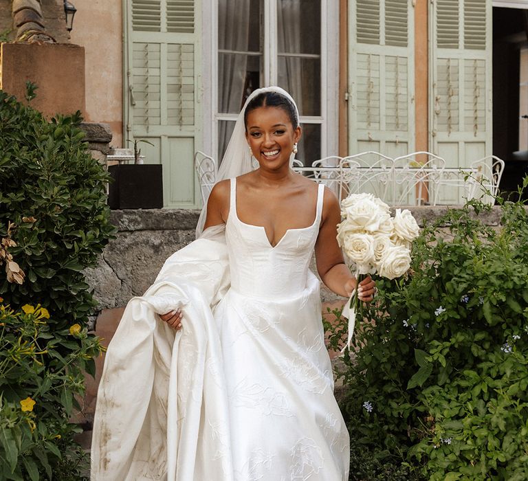 suzanne-neville-wedding-dress-and-white-rose-bouquet