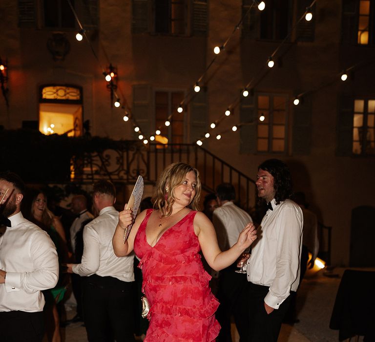 wedding-guest-wearing-red-ruffle-wedding-guest-dress