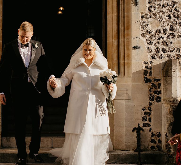 bride-and-groom-exit-their-ceremony-as-a-married-couple