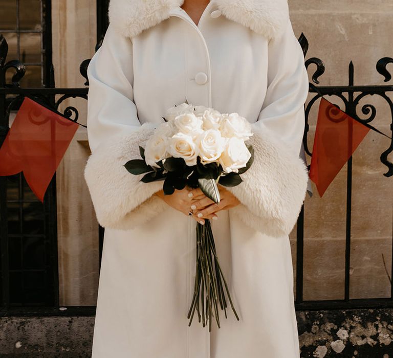 bride-wearing-faux-fur-white-coat-for-winter-wedding