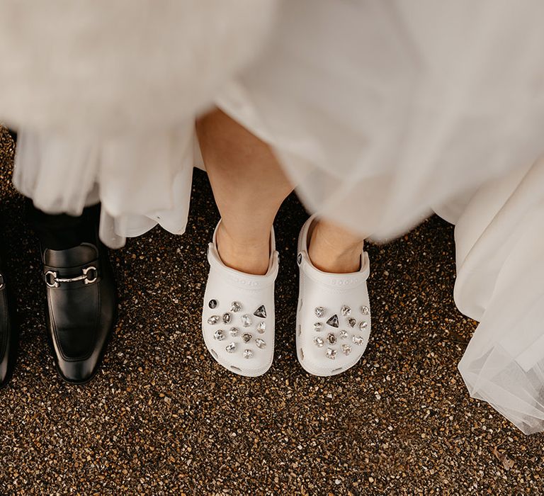 bride-wearing-white-crocs-and-groom-wearing-shiny-shoes