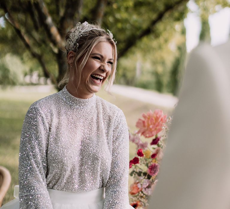 bride-wearing-sparkly-long-sleeve-bridal-top-and-headband