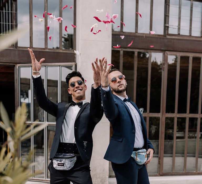 flower-men-throwing-confetti-from-bum-bags-in-navy-suits