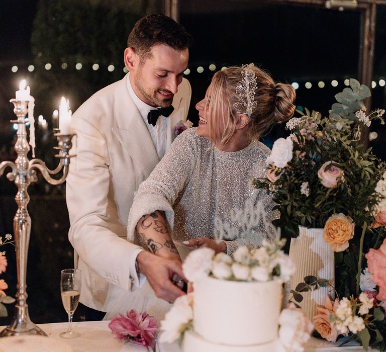 the-bride-and-groom-cut-their-wedding-cake