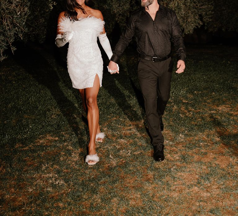 bride-in-short-wedding-reception-dress-with-groom-in-black-suit-and-cowboy-hat