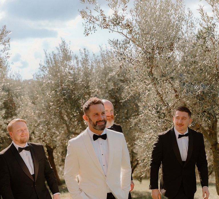 groom-and-groomsmen-wearing-black-tie-for-luxe-destination-wedding