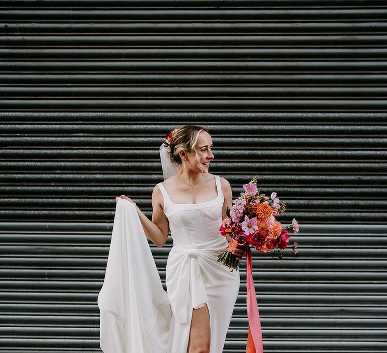 bride-wearing-red-wedding-shoes-with-pink-bouquets