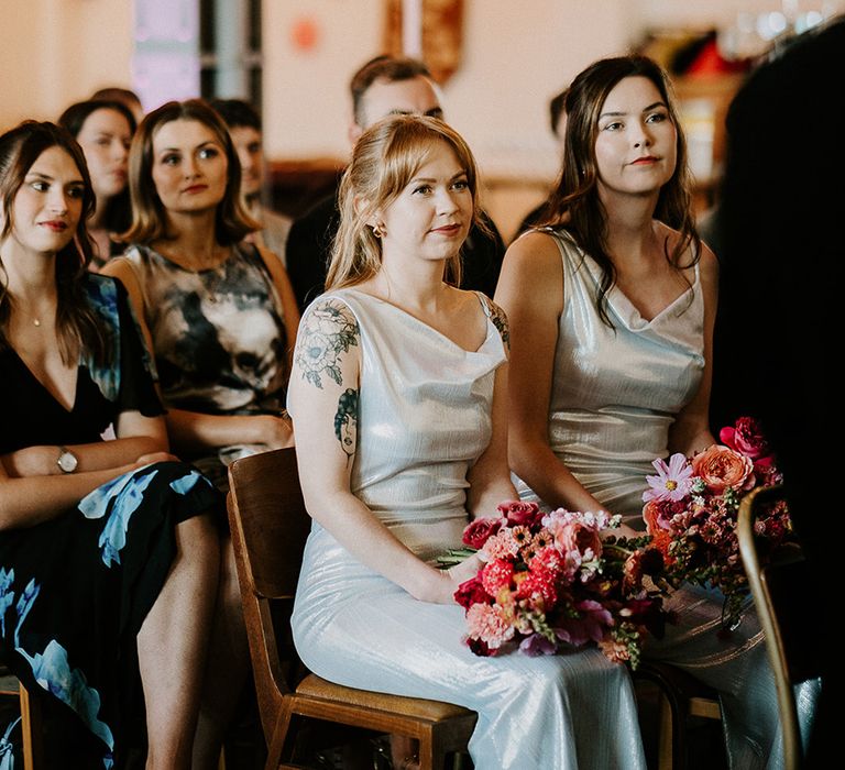 bridesmaids-listening-at-wedding-ceremony