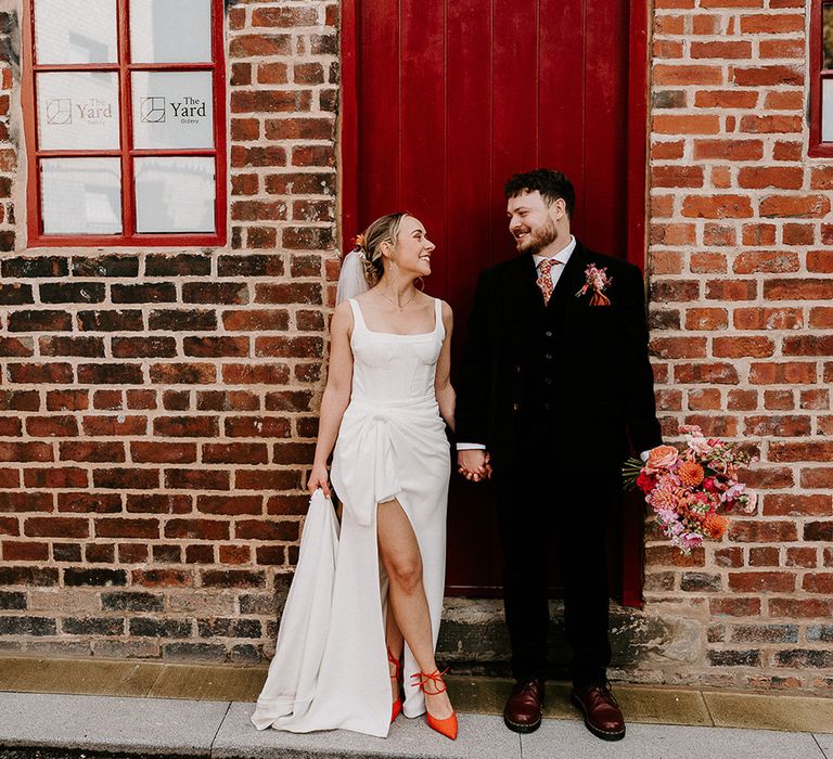 hera-couture-wedding-dress-worn-by-bride-with-groom