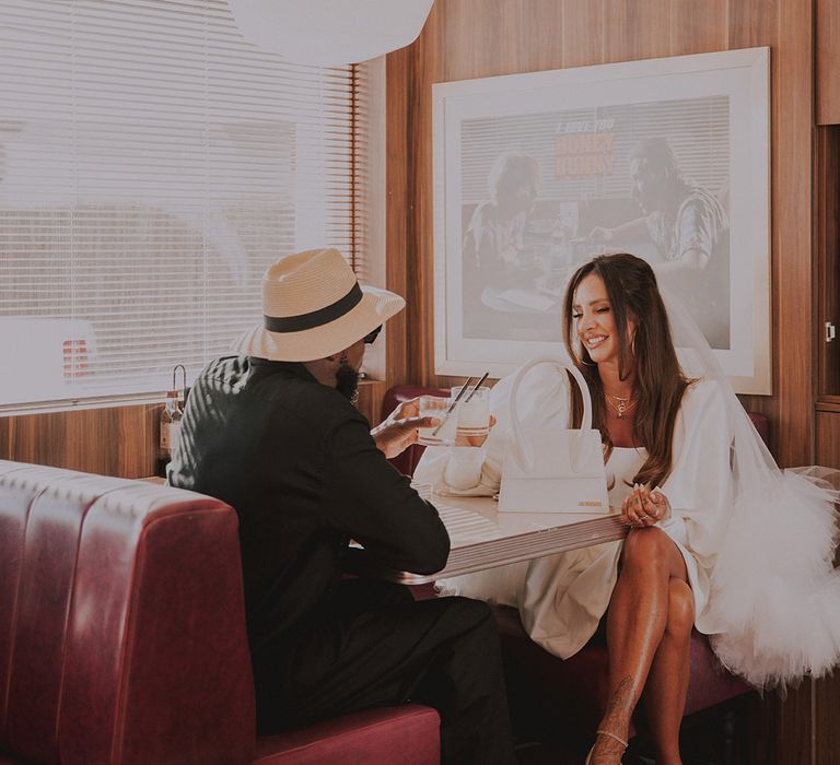 bride-and-groom-at-diner-for-elopement-wedding