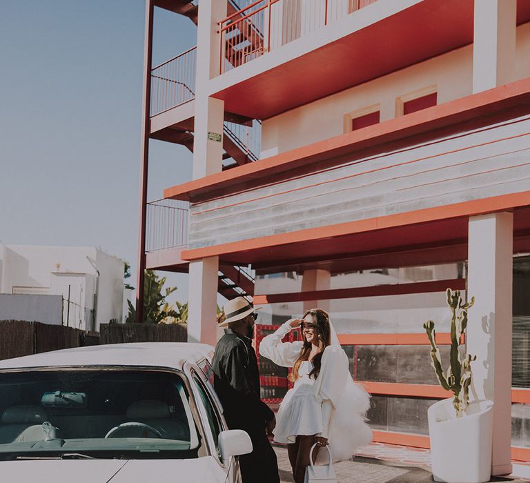 bride-and-groom-at-limousine-wedding-car