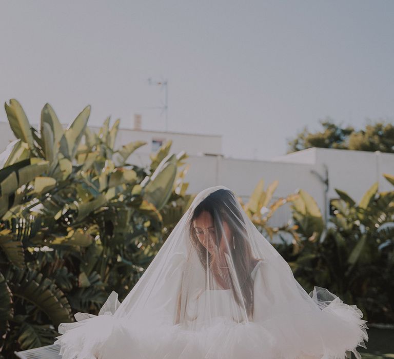 bride-wearing-ruffle-wedding-veil