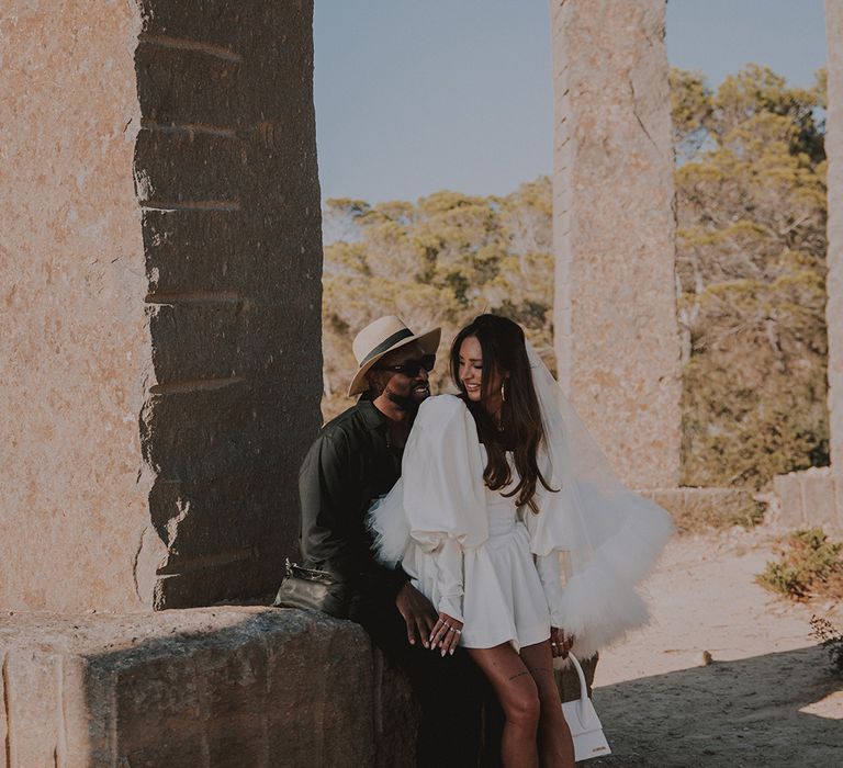 bride-wearing-white-jacquemus-bag-and-louboutin-shoes