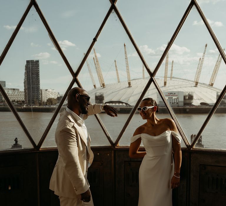 bride-and-groom-at-london-wedding-with-view-of-millenium-dome