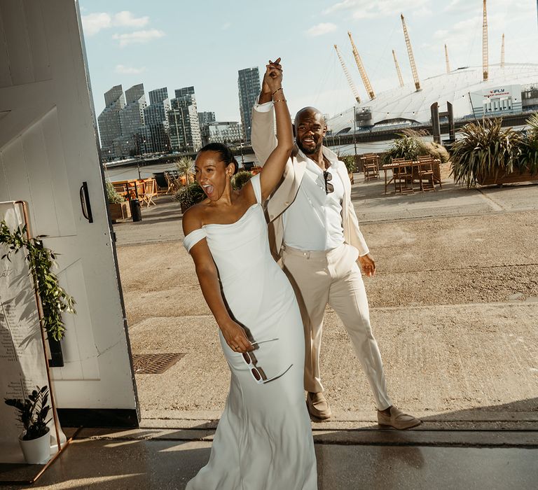 bride-and-groom-make-entrance-into-wedding-breakfast