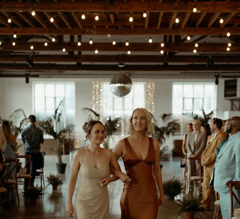 bridesmaids-walking-down-the-aisle