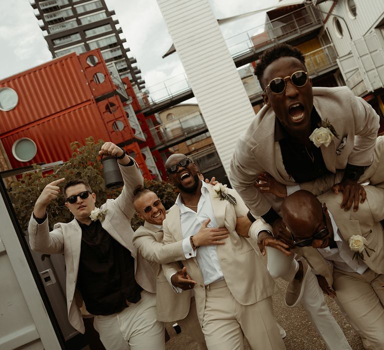 groom-and-groomsmen-in-cream-wedding-suit-jackets