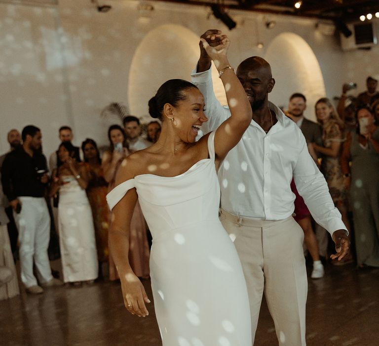 groom-spins-bride-around-for-first-dance