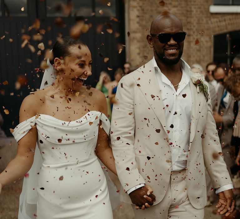 martina-liana-wedding-dress-and-groom-in-cream-suit-at-london-wedding