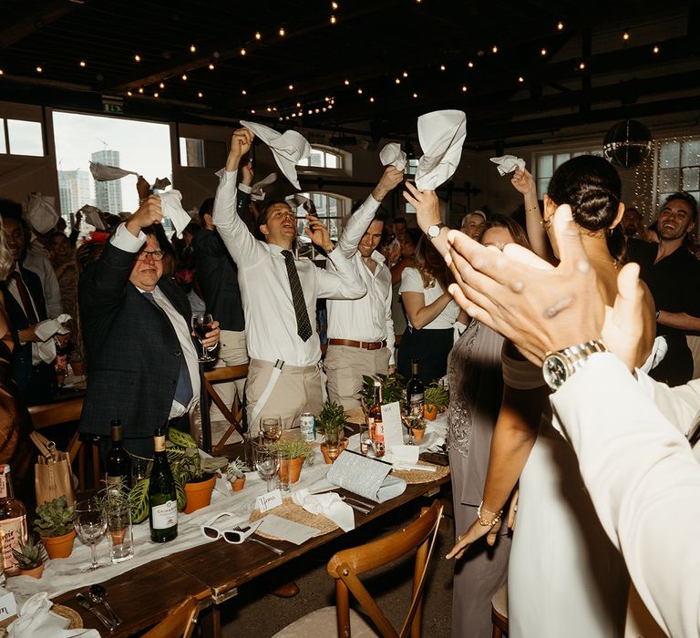 napkins-waved-by-guests-to-welcome-couple