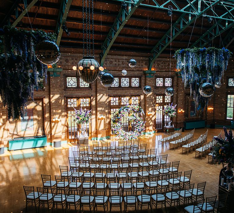 blue-and-purple-wedding-flowers-with-disco-balls-at-wedding-venue