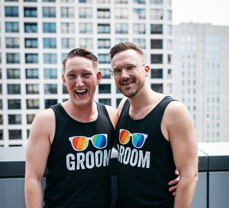 grooms-wearing-maching-vests-with-rainbow-sunglasses