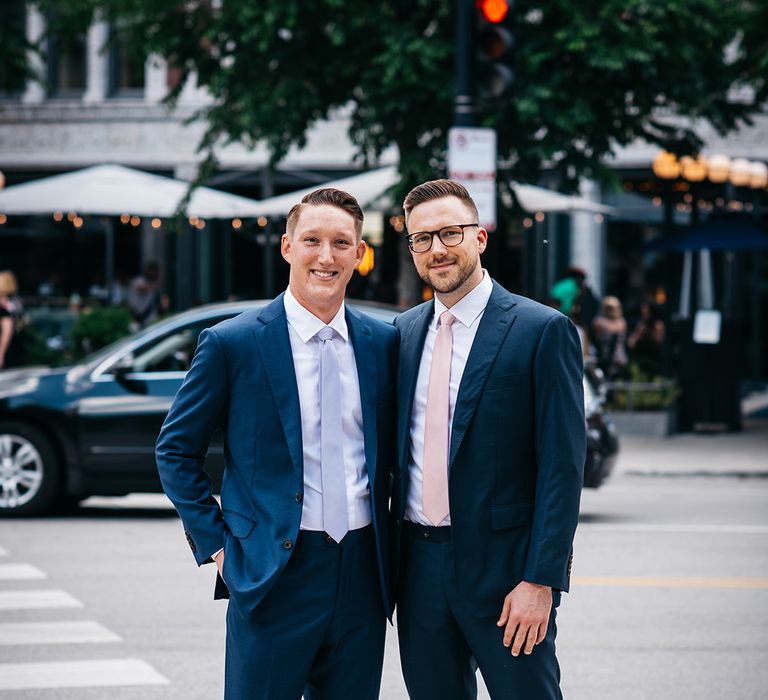 two-grooms-wearing-navy-blue-wedding-suit