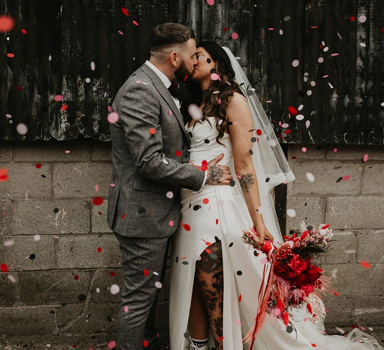 confetti-moment-as-bride-and-groom-kiss