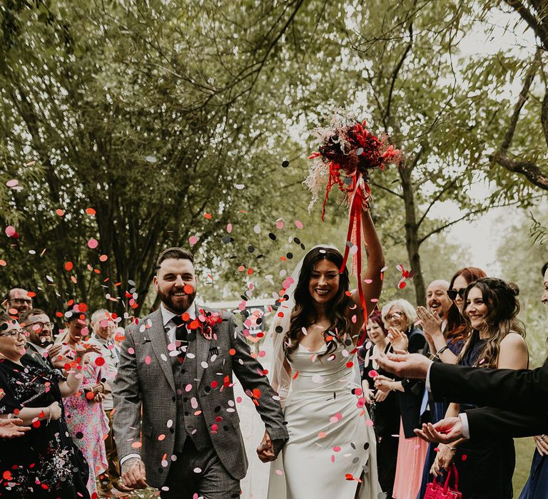 pink-and-red-confetti-moment-for-bride-and-groom