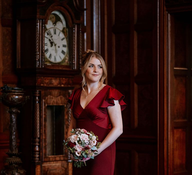 burgundy-butterfly-sleeve-bridesmaid-dress-with-bouquet