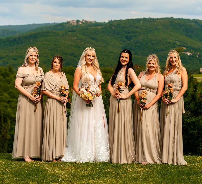 bridal-party-wearing-gold-bridesmaid-dresses-at-destination-wedding