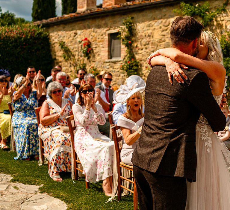 bride-and-groom-share-first-kiss-as-married-couple