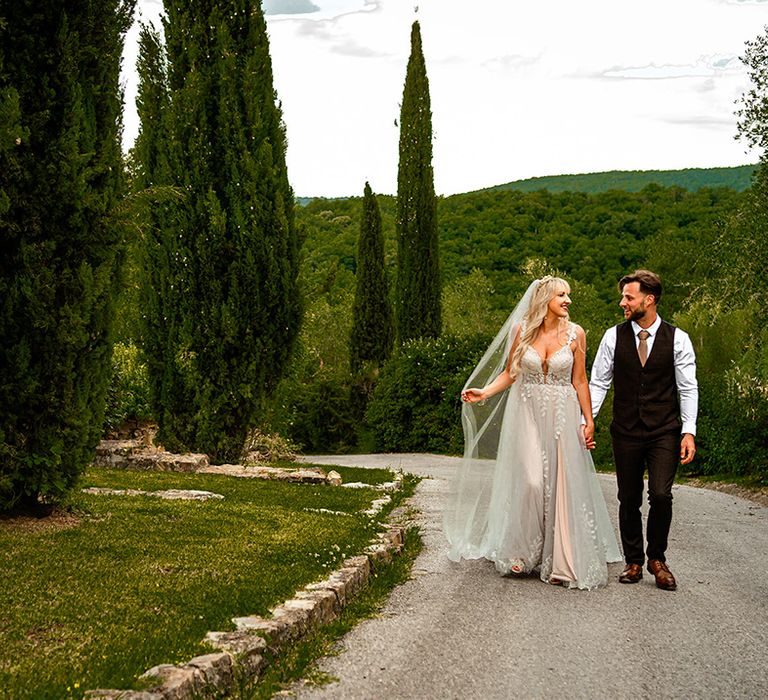 bride-and-groom-walking-around-wedding-venue