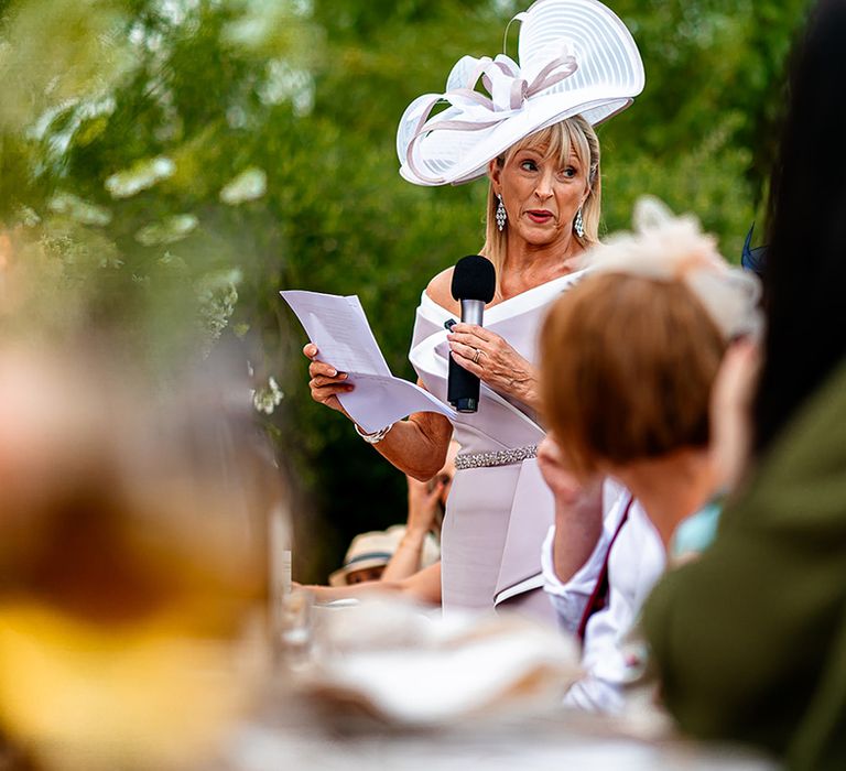 mother-of-the-bride-in-lilac-reads-wedding-speech