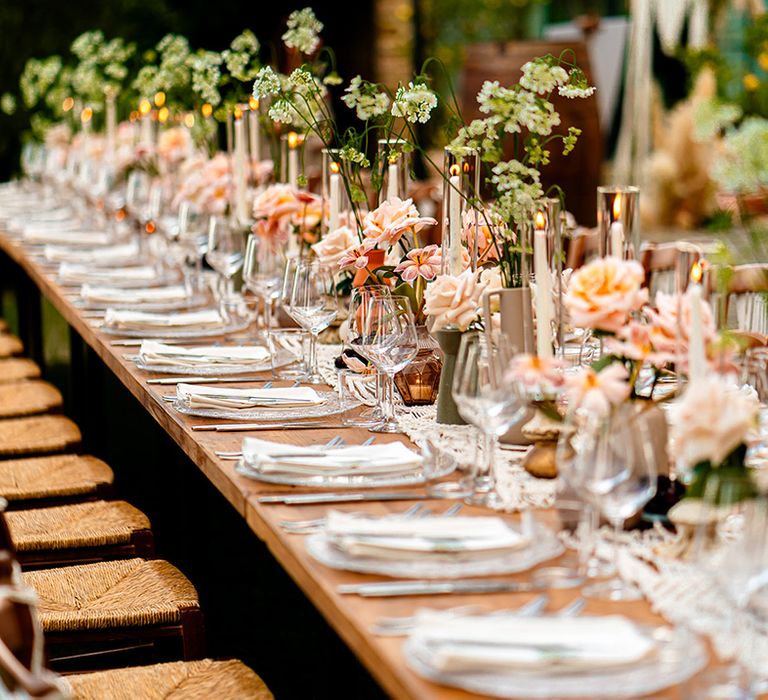 pink-rose-table-decorations-with-hurricane-vases-and-candles