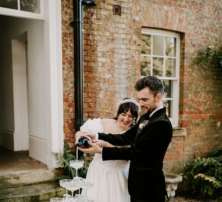 bride-and-groom-pour-prosecco-for-prosecco-tower