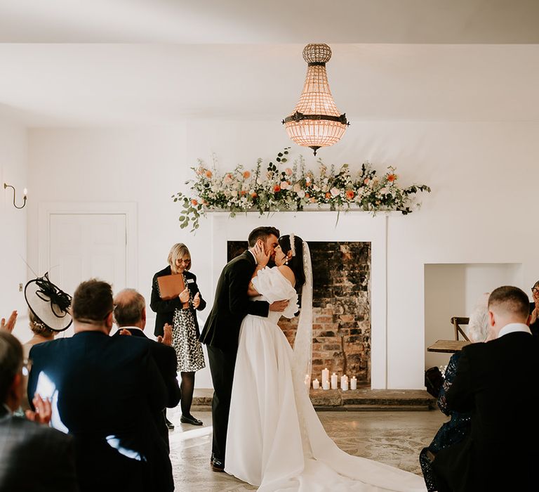 first-kiss-for-bride-and-groom-at-wedding