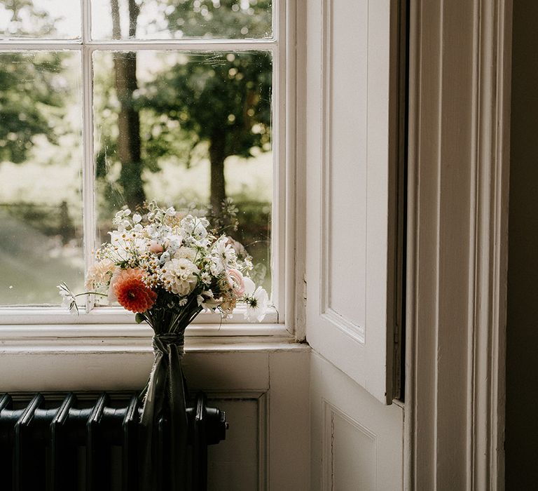 pastel-bridal-bouquet-at-leaning-against-window