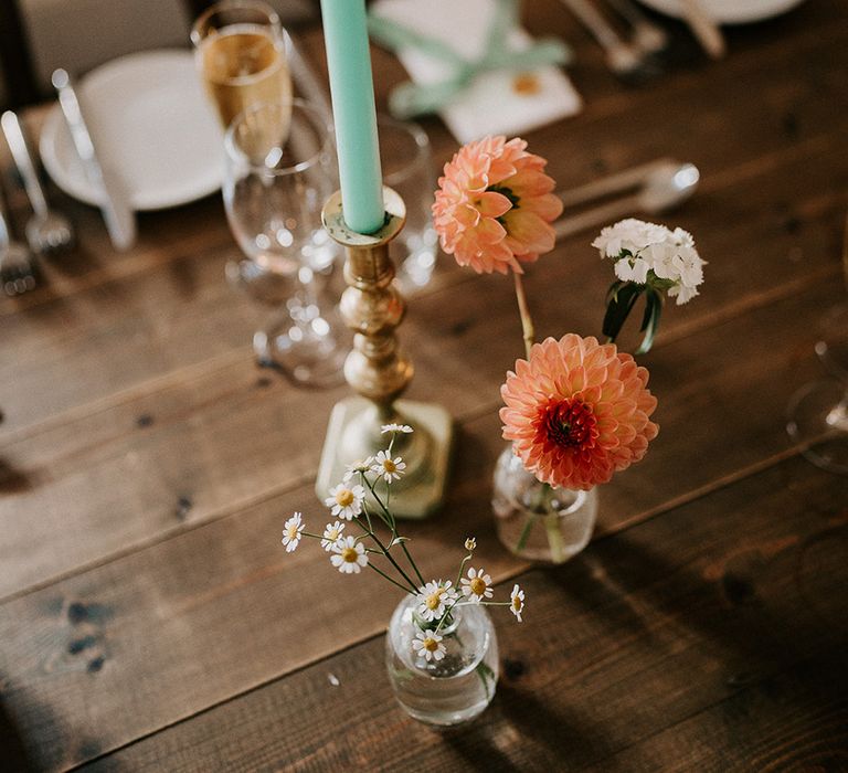 teal-candles-with-peach-flowers-table-decor